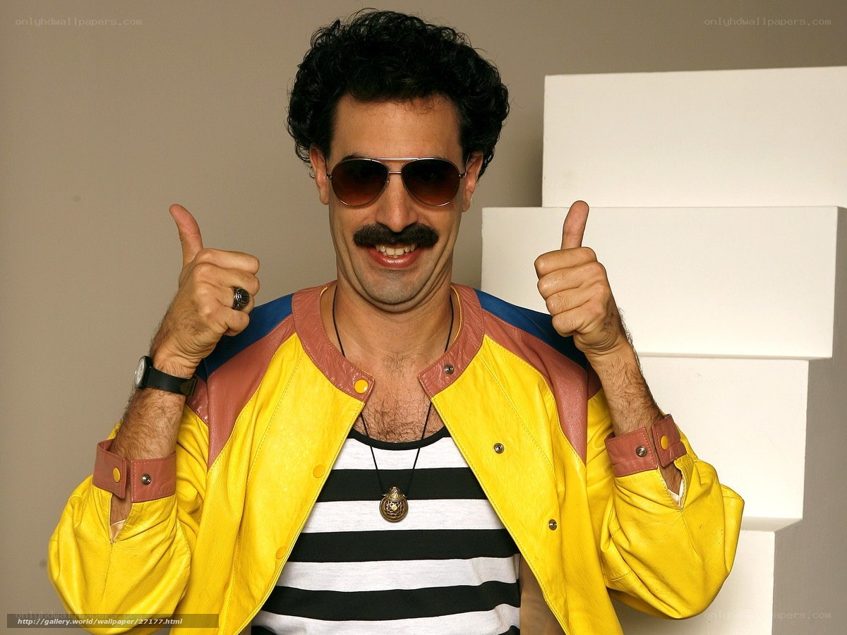 Man in yellow jacket giving thumbs up