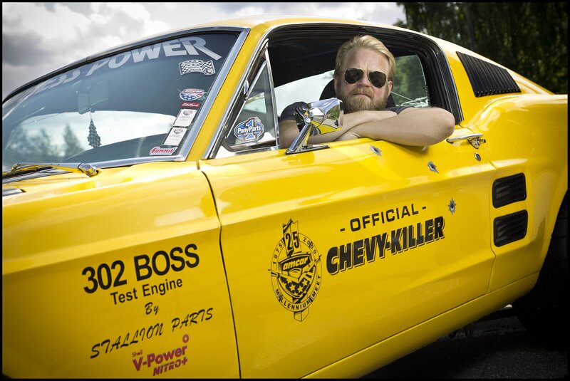 Man in yellow muscle car