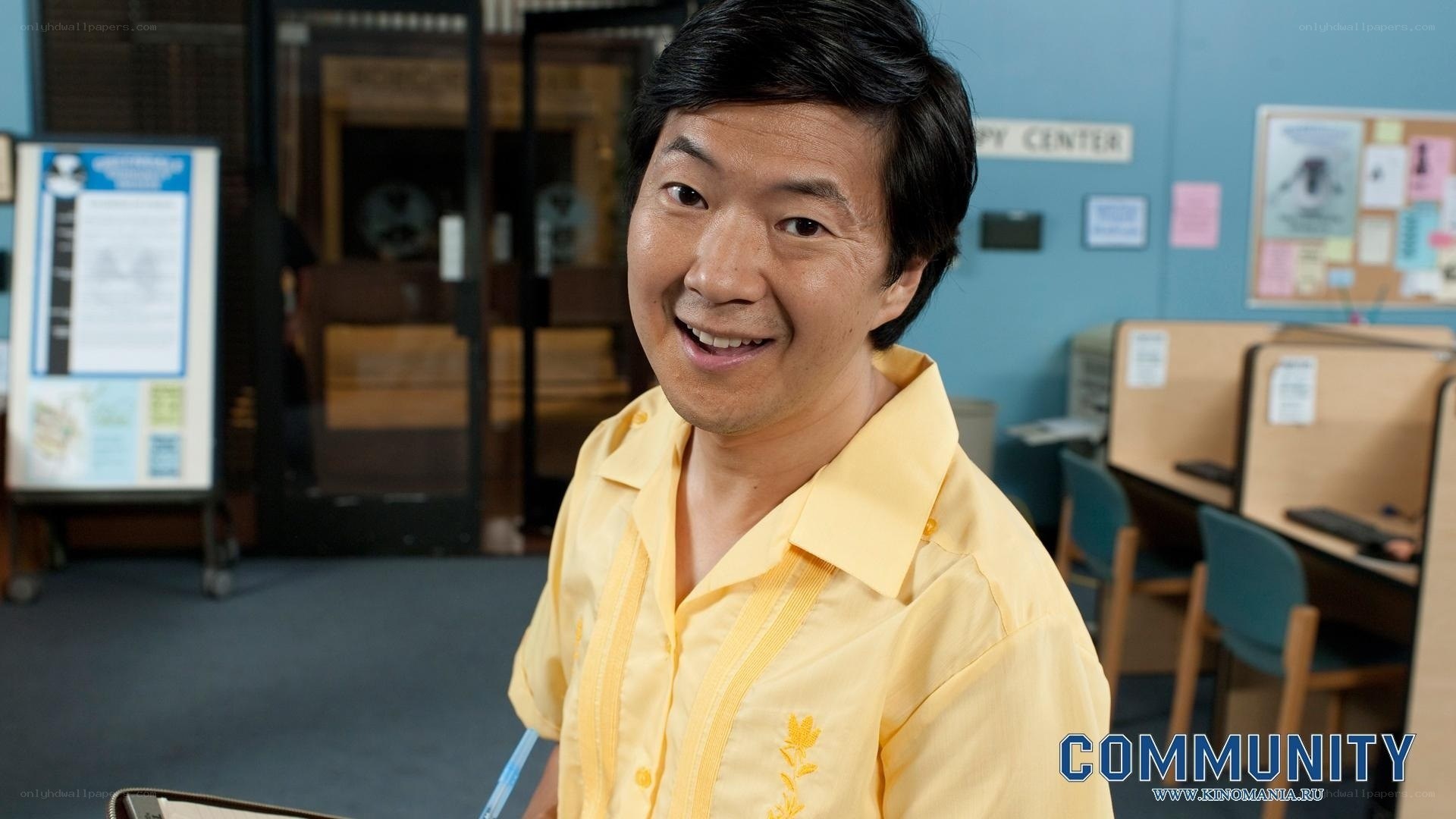 man in yellow shirt smiling