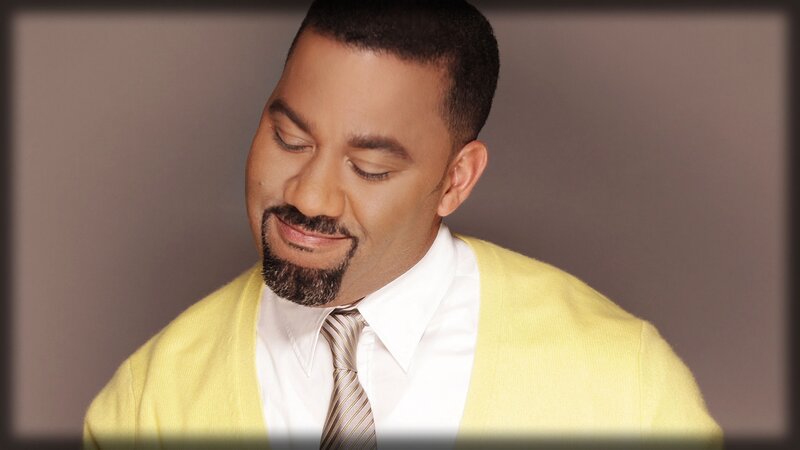 man in yellow sweater