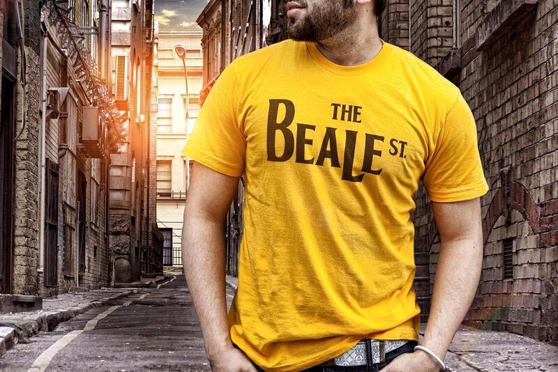 man in yellow t-shirt on street