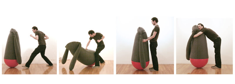 man interacting with beanbag sculpture