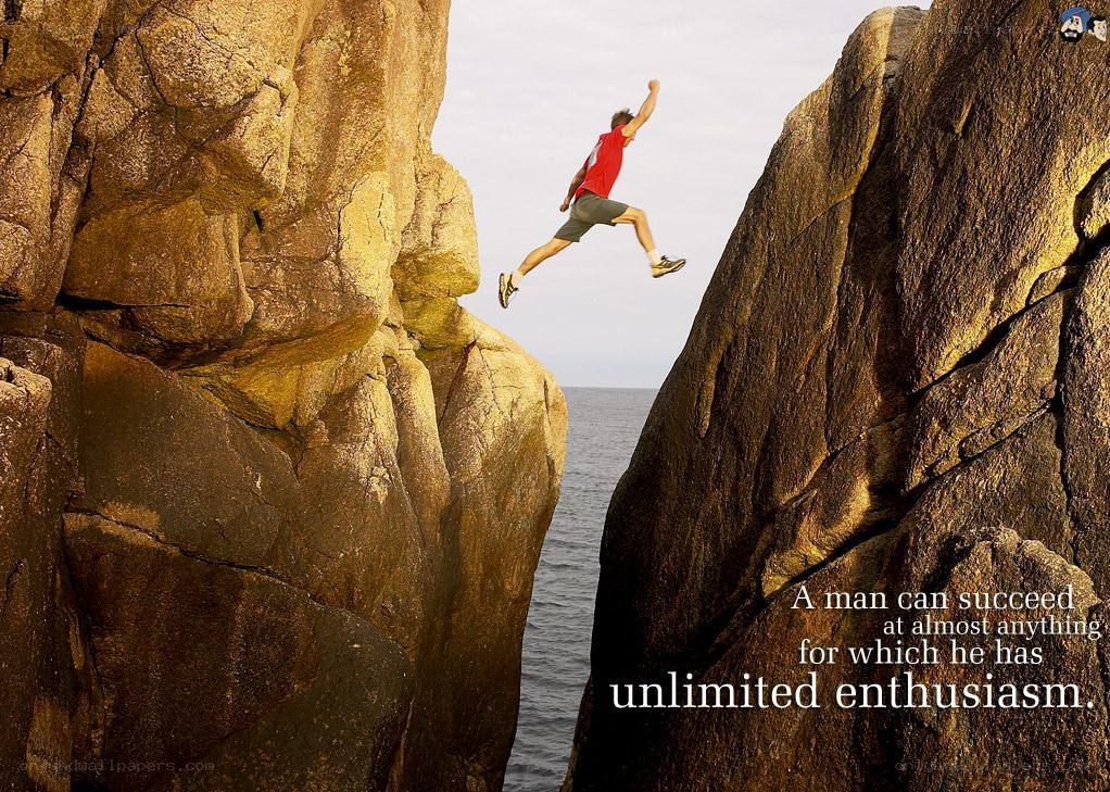 man jumping between cliffs