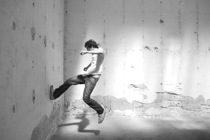 Man jumping in an empty room