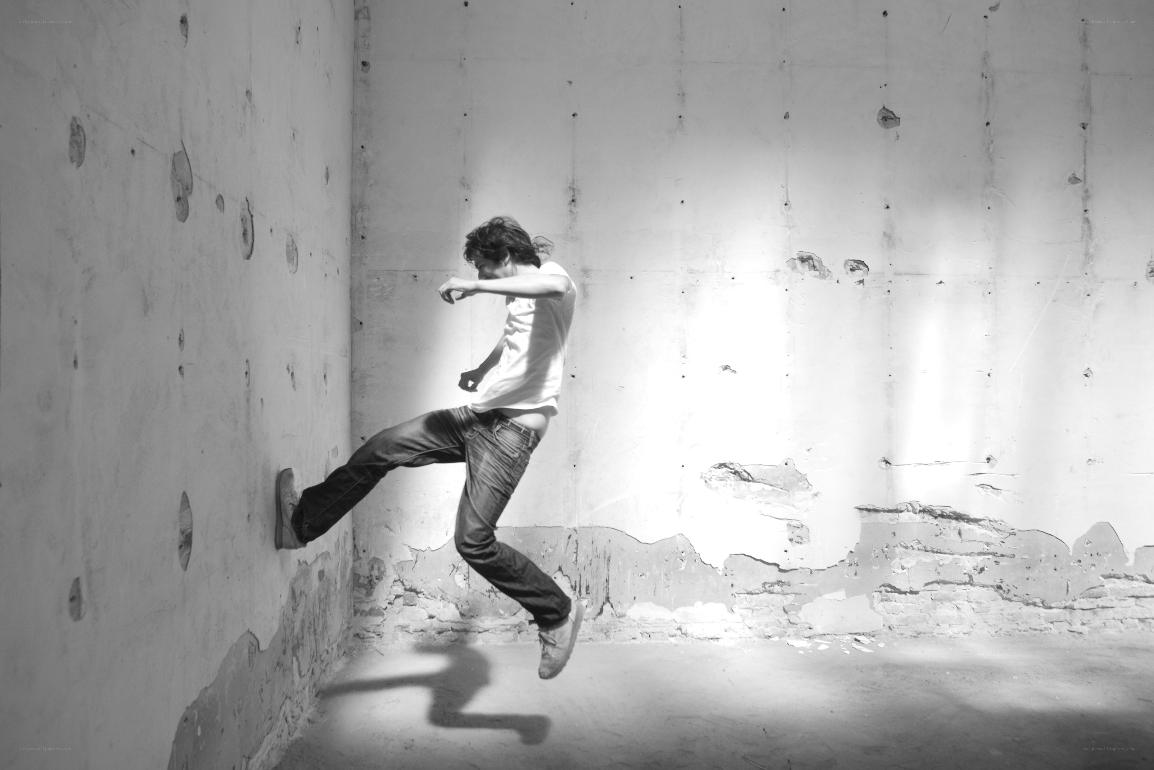 Man jumping in an empty room