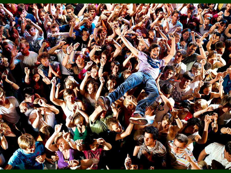 Man Jumping in Crowd
