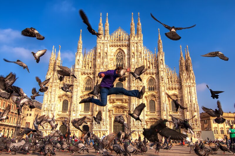 Man jumping in front of cathedral