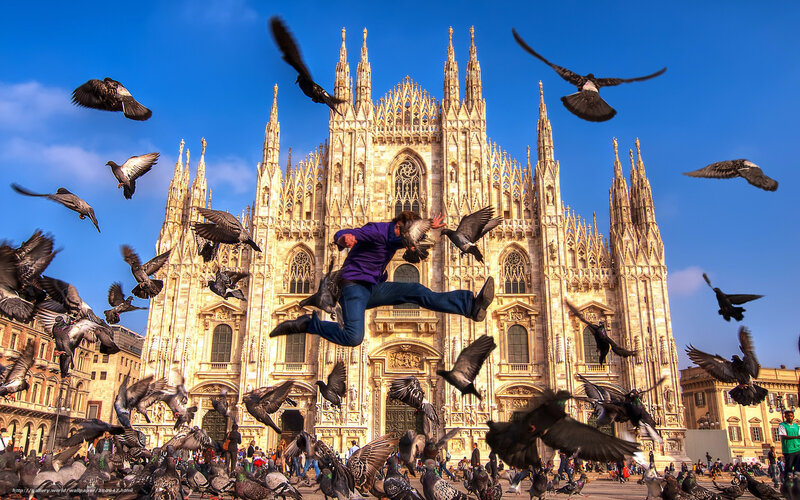 Man jumping in front of cathedral