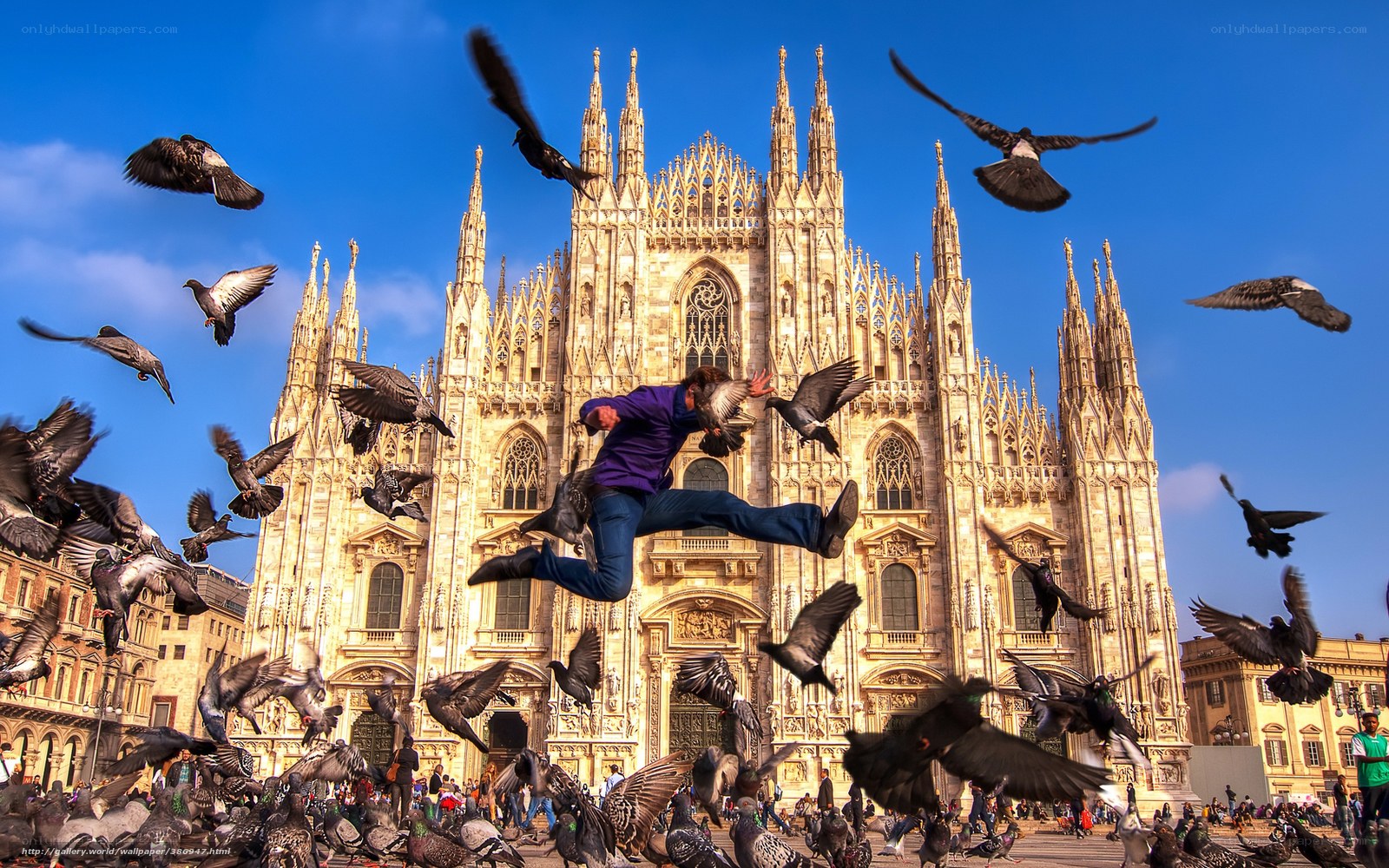 Man jumping in front of cathedral
