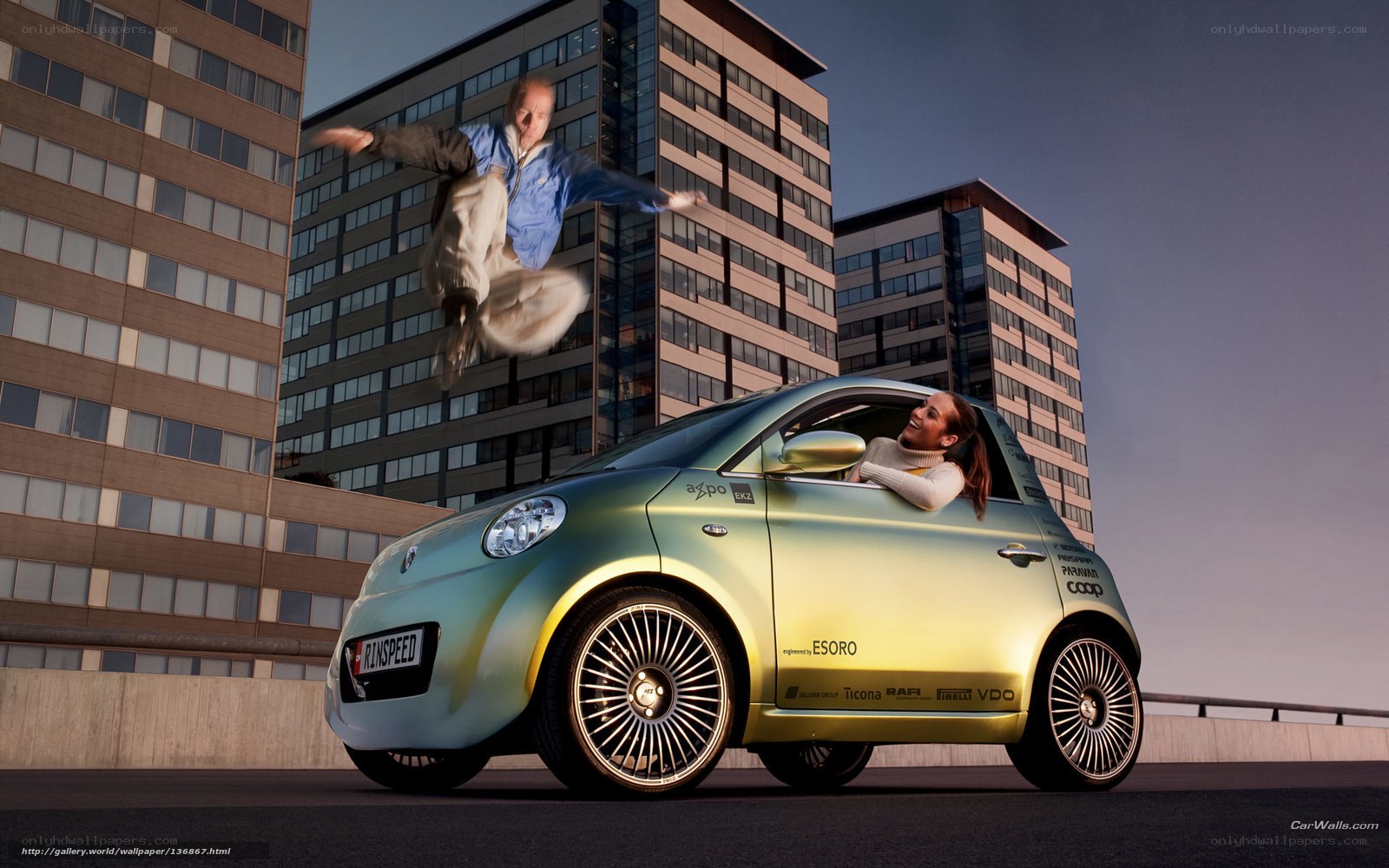 Man jumping near green car