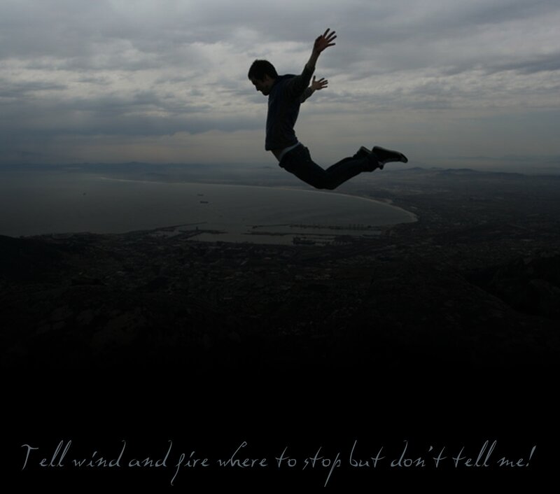 man jumping on cliff