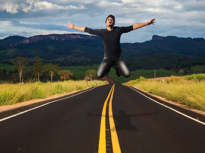 Man Jumping on Road