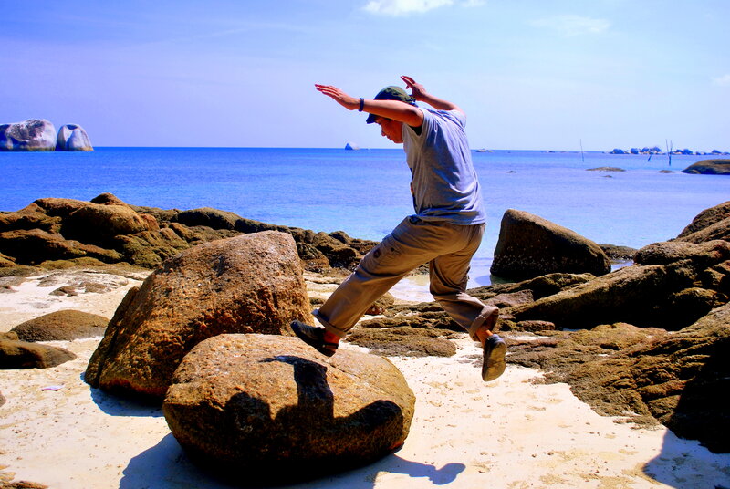 Man Jumping on Rocks