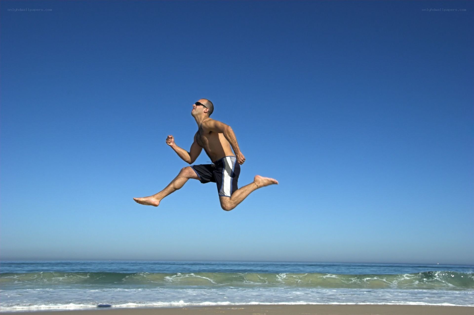 Man jumping on the beach