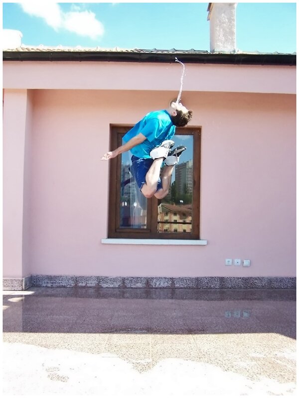 Man jumping with water spray