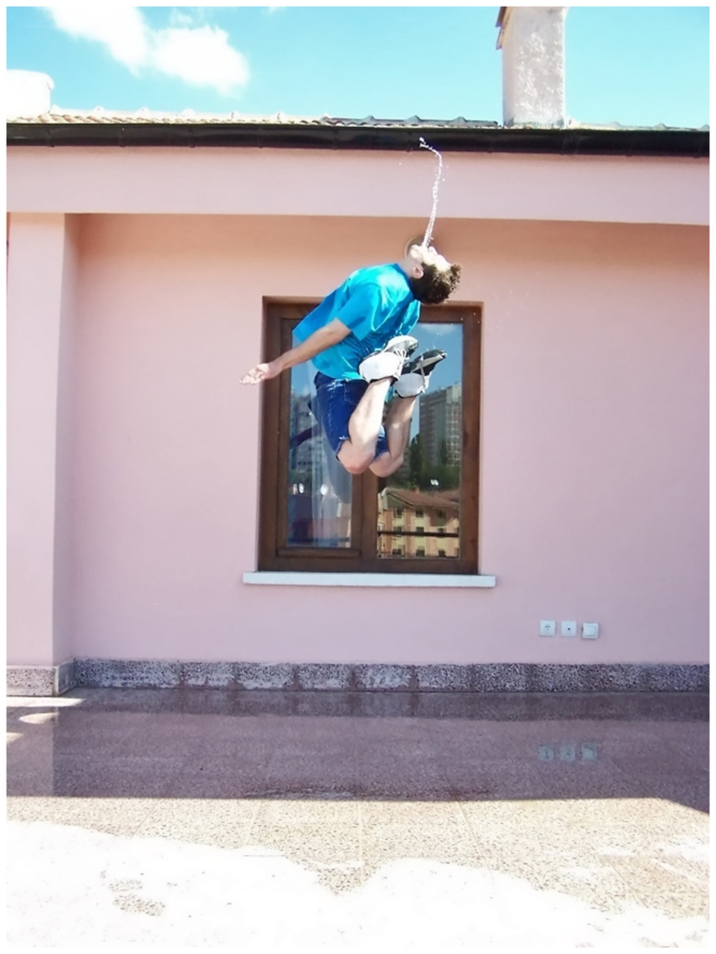 Man jumping with water spray