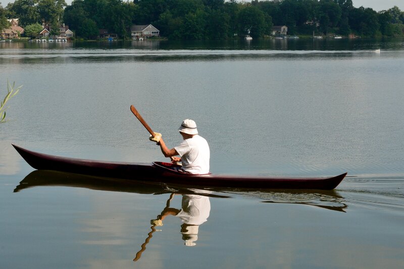 Man Kayaking on Lake