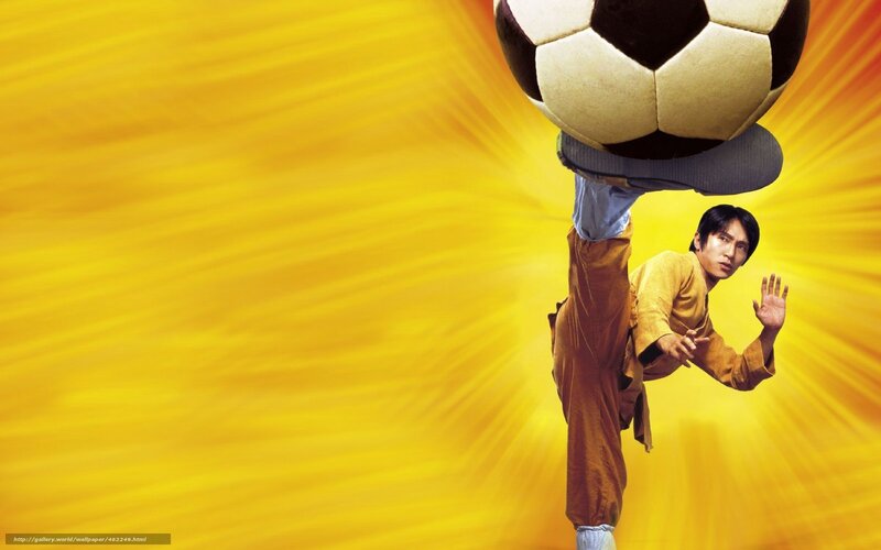 man kicking soccer ball