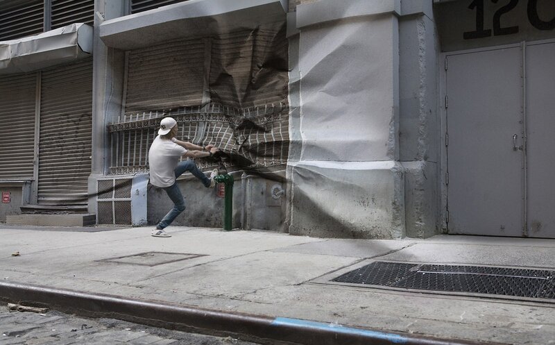 man kicking wall illusion