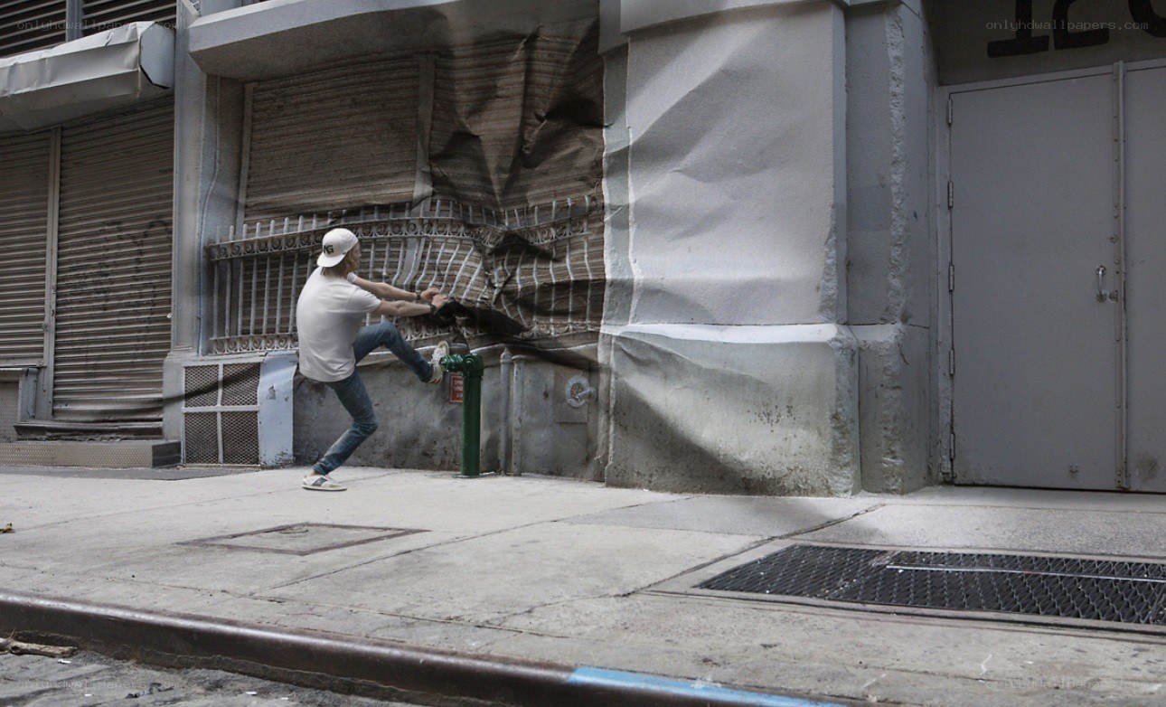 man kicking wall illusion