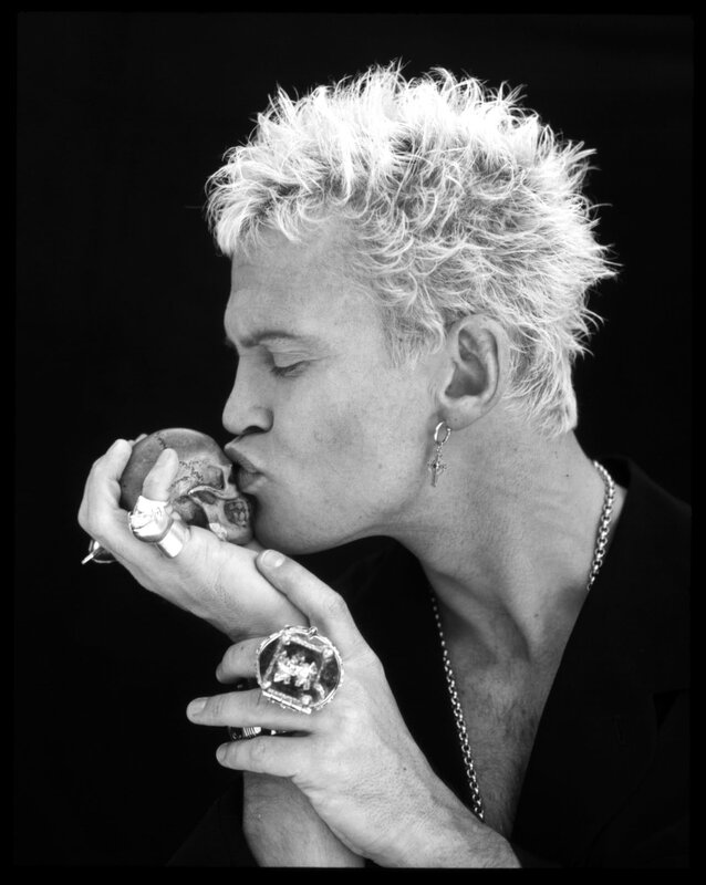 man kissing a skull