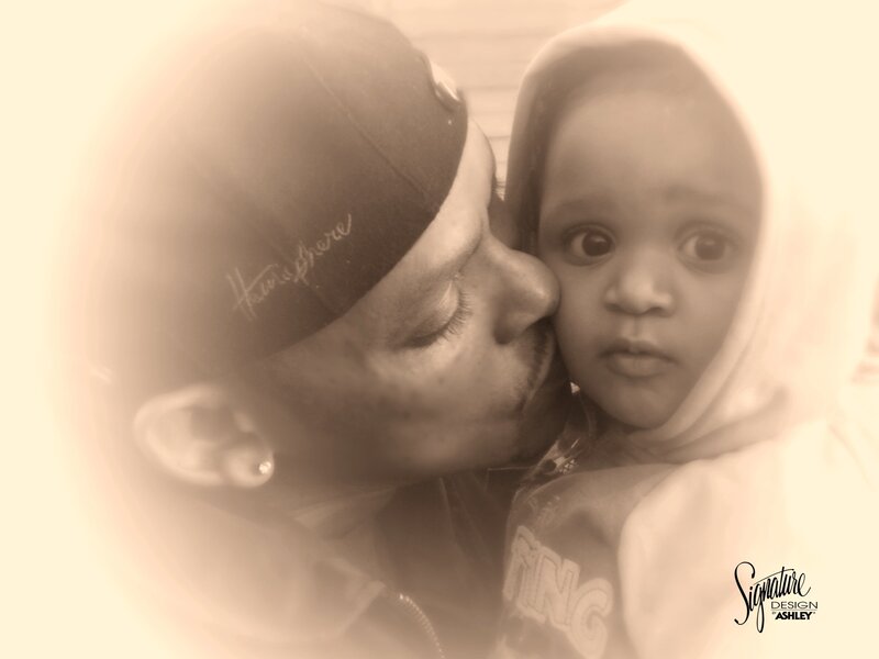 Man Kissing Child
