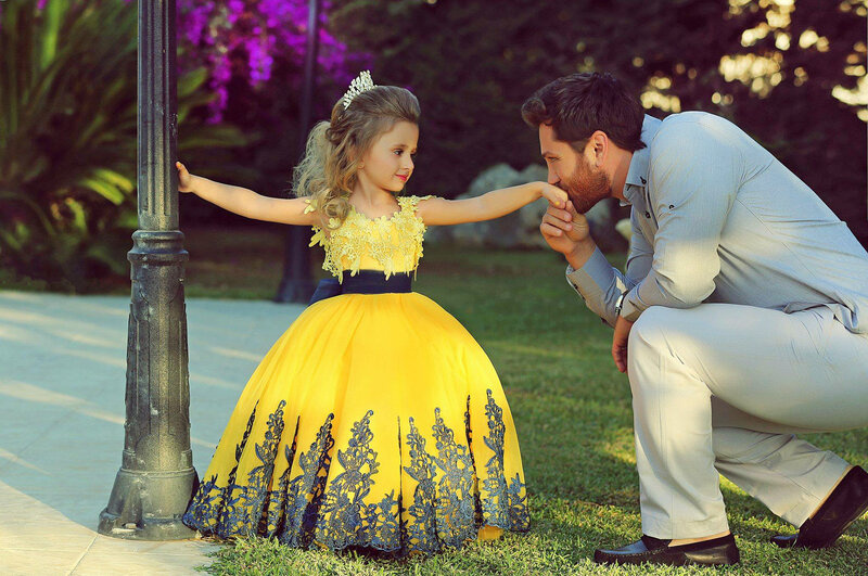 Man Kissing Girl's Hand