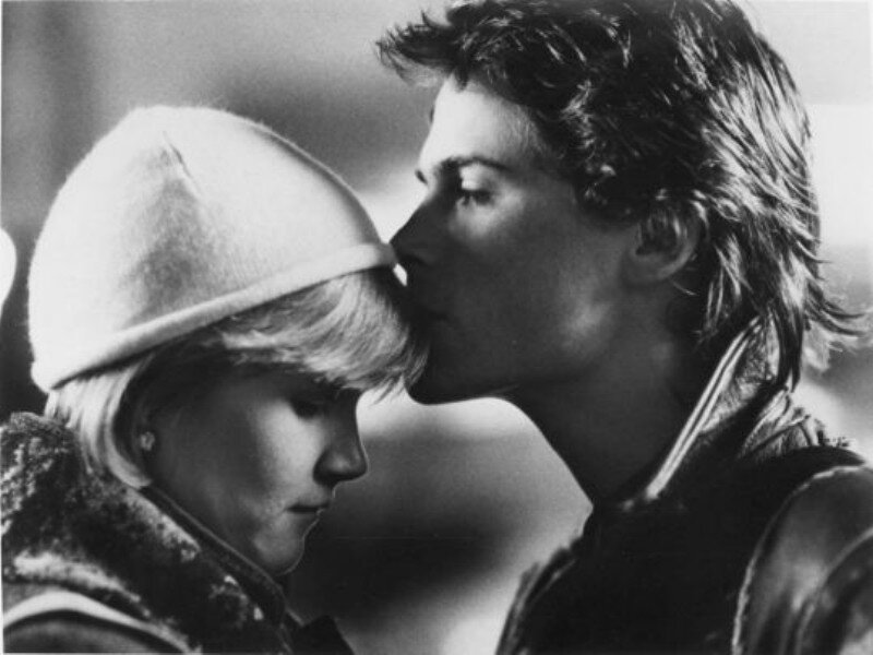 Man Kissing Woman on Forehead