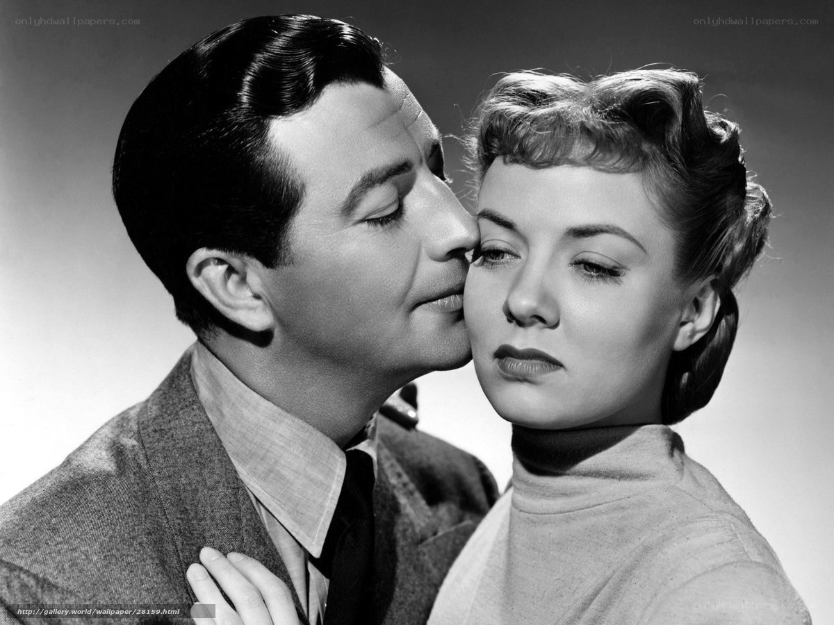 Man kissing woman's cheek