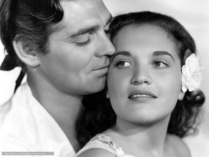 Man kissing woman's forehead