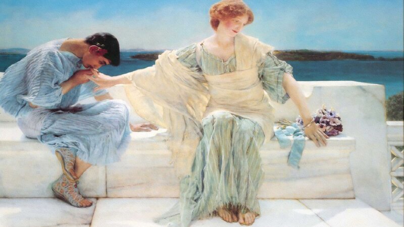 Man kissing woman's hand
