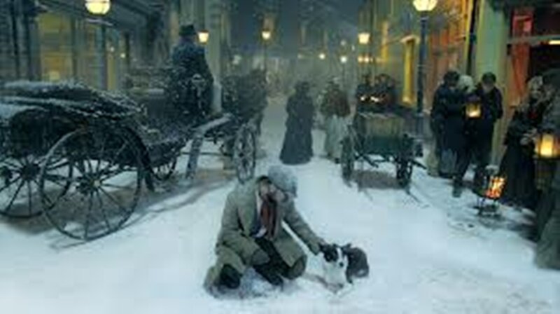 Man Kneeling in Snow