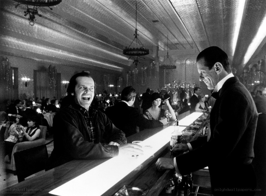 Man laughing at bar