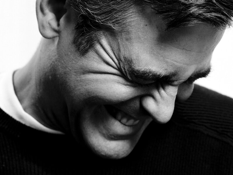 man laughing in black and white