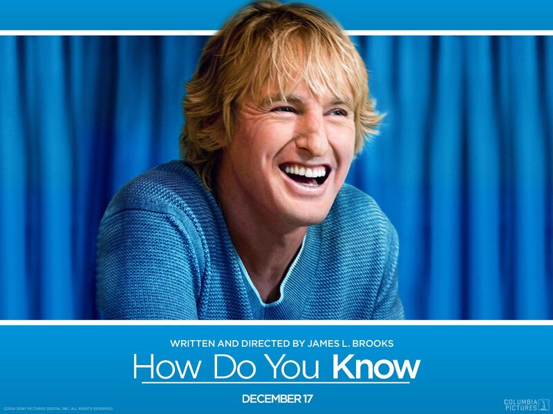 Man Laughing in Blue Sweater