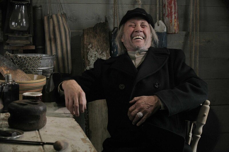 Man Laughing in Chair
