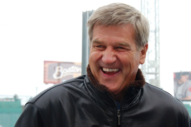 man laughing in leather jacket