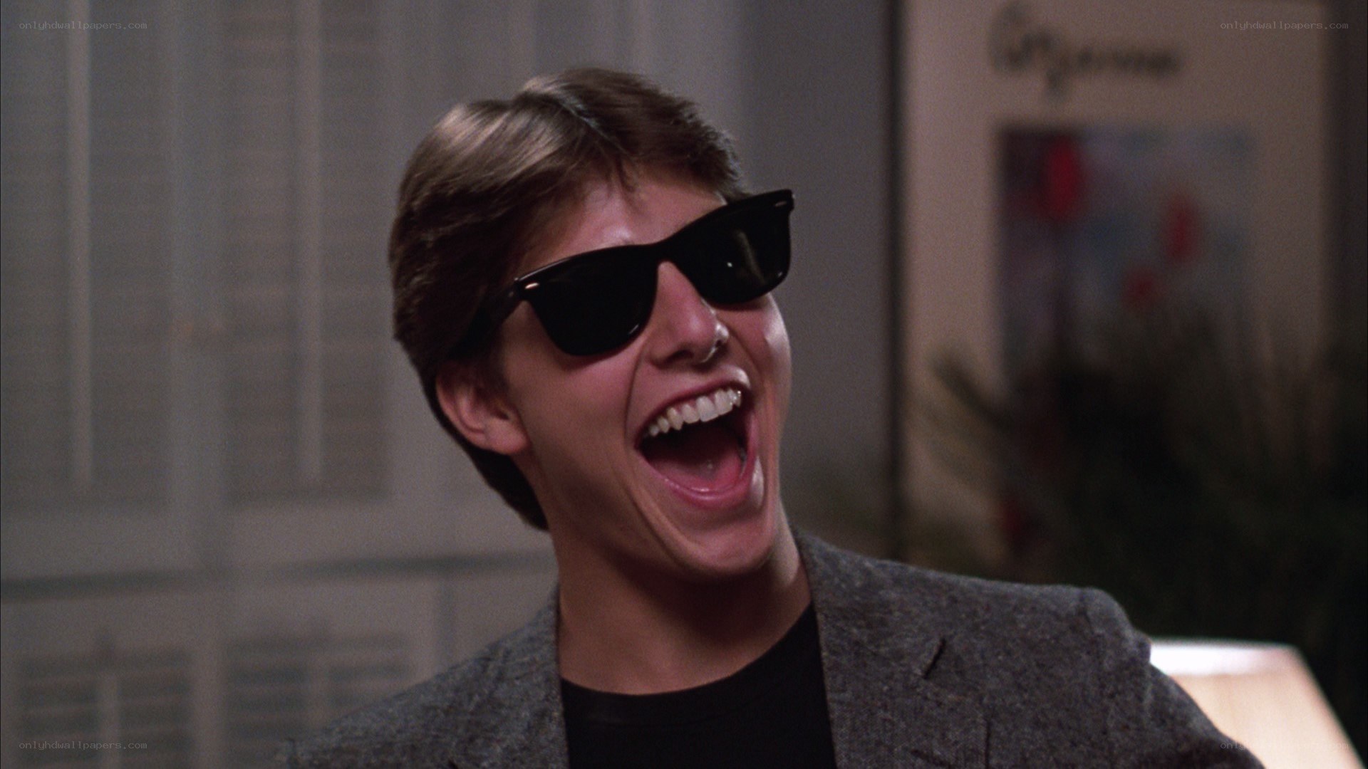 man laughing in sunglasses