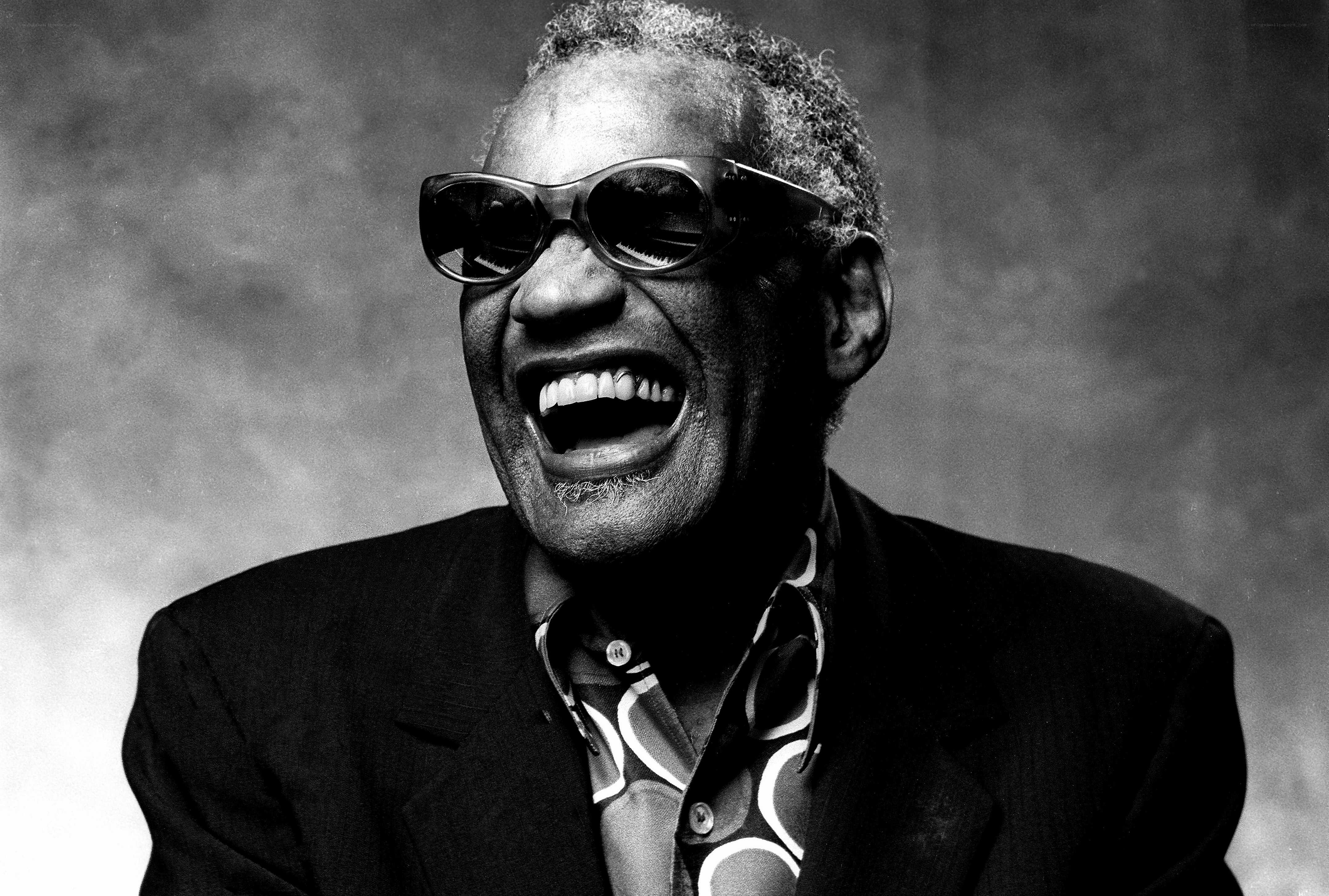Man laughing in sunglasses