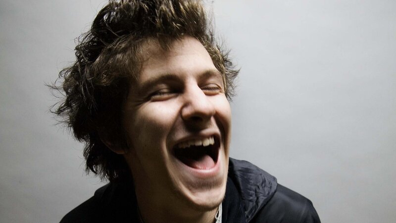 man laughing loudly
