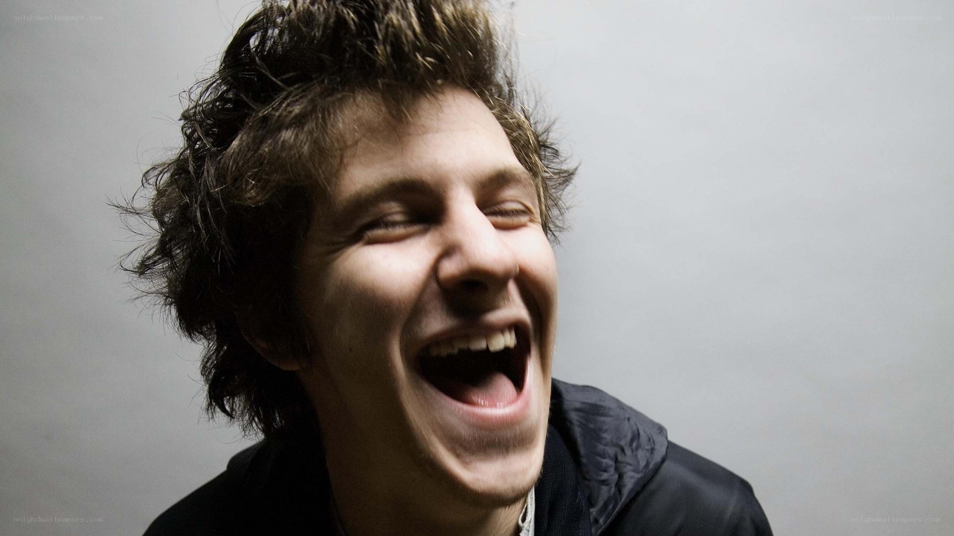 man laughing loudly