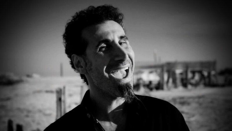 man laughing on beach