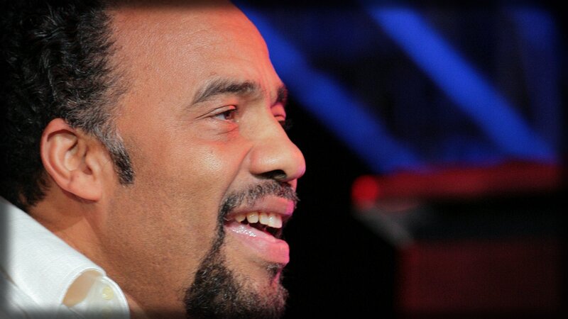 man laughing on stage