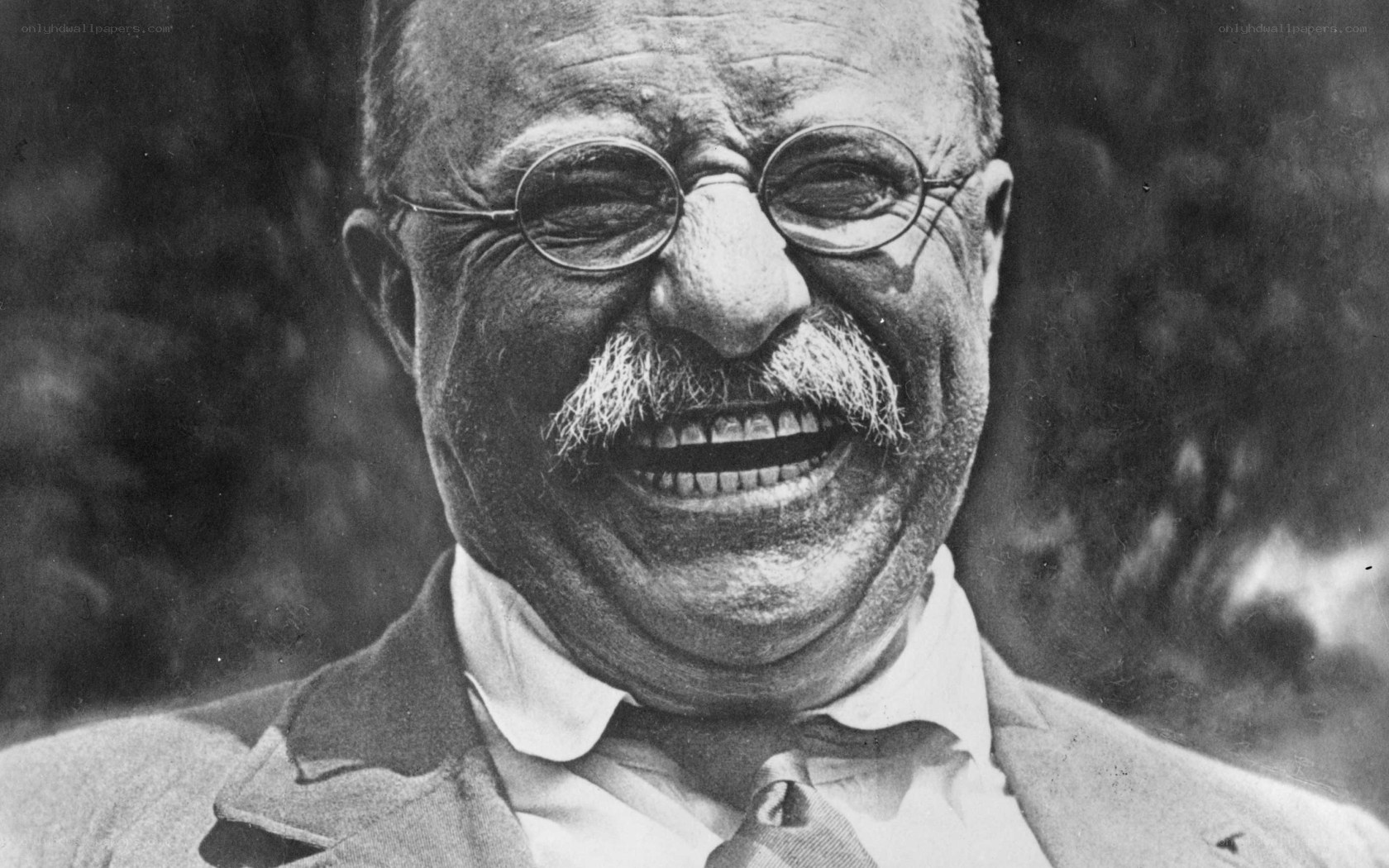 Man laughing with glasses