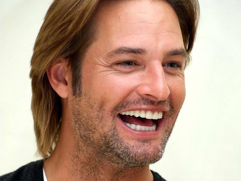 man laughing with long hair