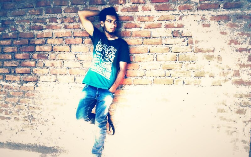 Man Leaning Against Brick Wall — Brown, Casual