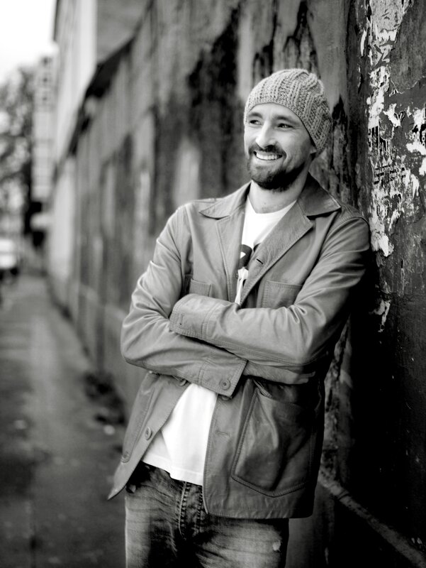 man leaning against wall