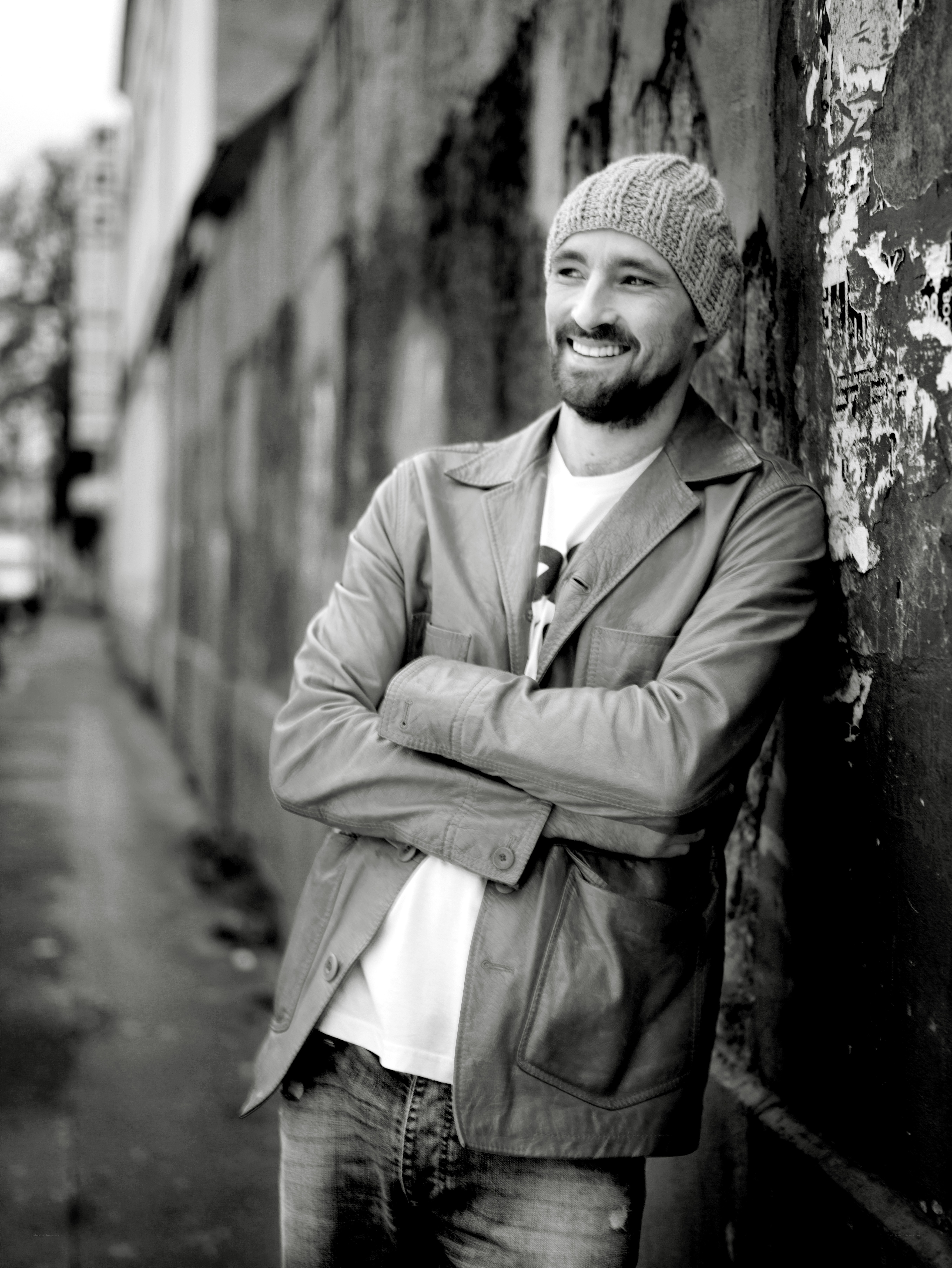 man leaning against wall