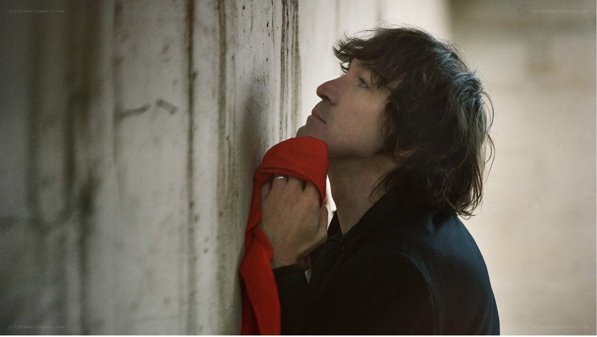 man leaning against wall