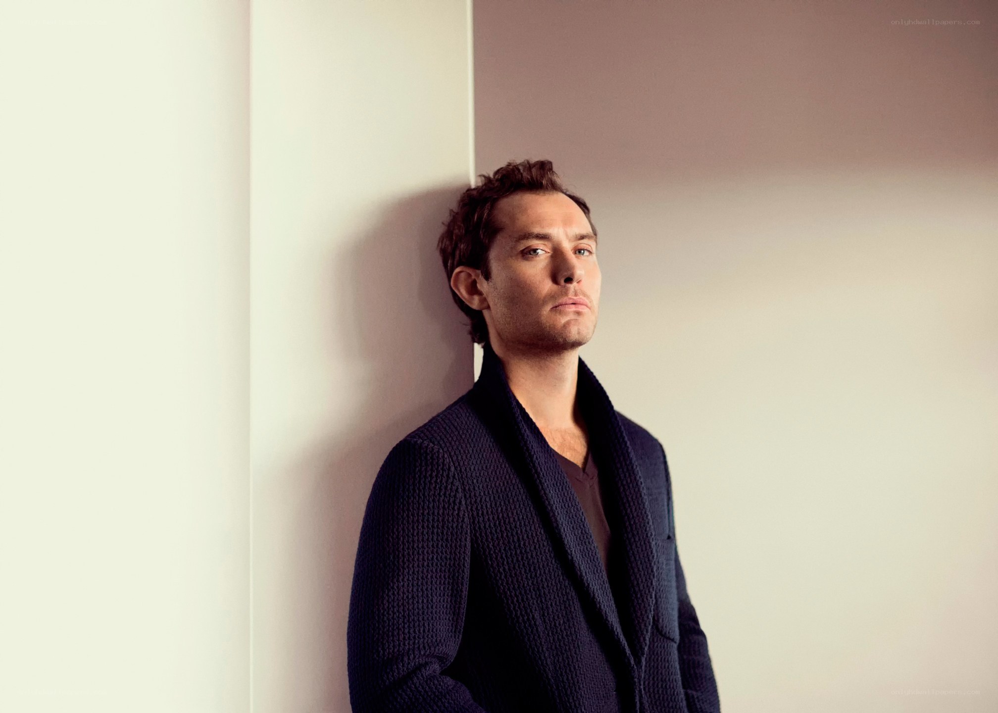 man leaning against wall